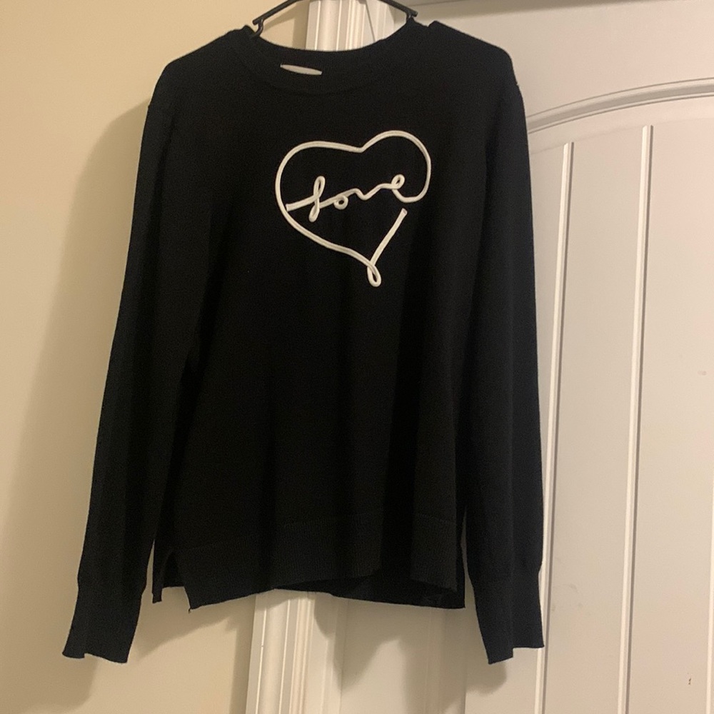 I don’t know the brand of the shirt it’s a black sweater size extra large.